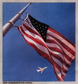 Plane Flying Under Half-Mast USA Flag